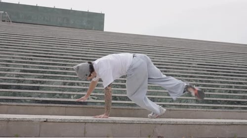 Man Breakdancing on Urban Stairs