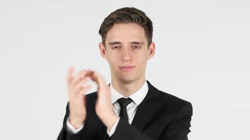 Young Adult Clapping in Dark Suit
