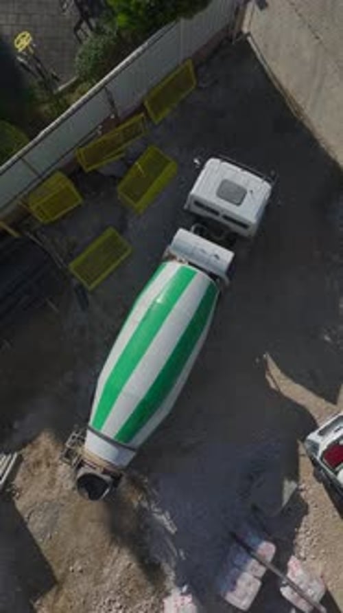 Vertical Video of Engineers Supervising Workers Building Walls and Laying Concrete Foundations