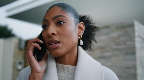 Attractive Woman Speaking Smartphone on Street Closeup. Serious African American Discussing Property