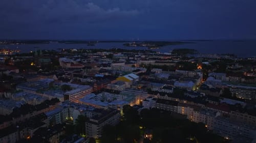 Forwards Fly Above Blocks of Apartment Buildings in Residential Urban Borough at Dusk Evening in