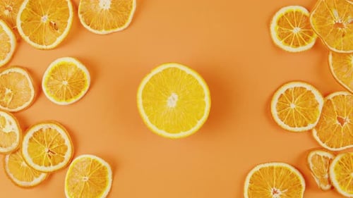 Cut Lemon on the Table Fresh Aroma Citrus Slices on Orange Background Top View Closeup Zoom Summer