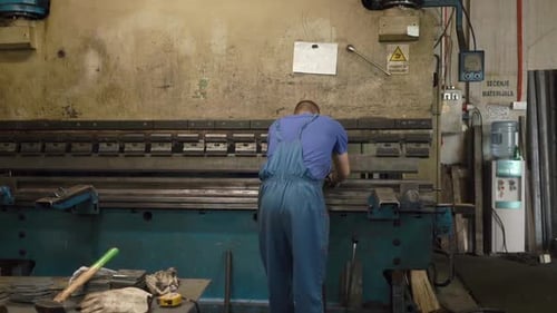Operator working cut and bending metal sheet by high precision metal sheet bending cnc control