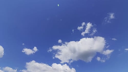 Majestic Clouds Drifting Across a Clear Blue Sky