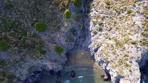 Coastal aerial view of small bay beach. Wild beach coast line view from above drone in the beach