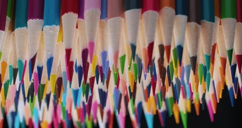 Closeup of Sharpened Colored Pencils Spinning in a Circle