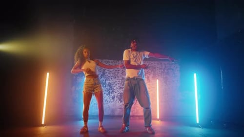 Fulllength Portrait of Two Happy Dancers Dancing Modern Choreography in Studio Positive Young People