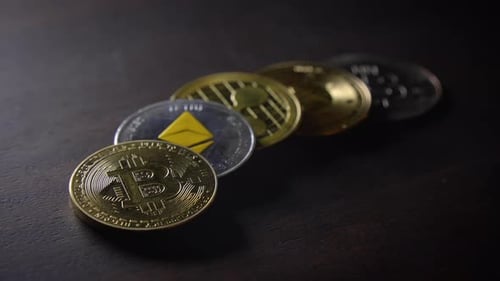 Close Up of Crypto Currency Coins on Wood