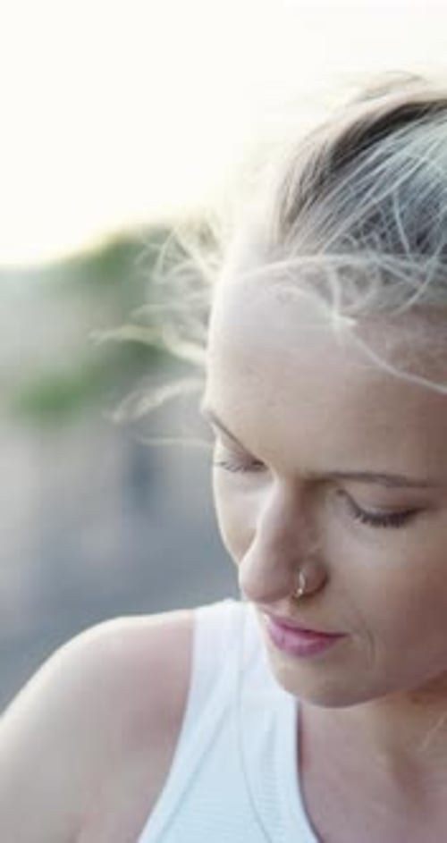 Outdoor, smile or woman with earphones for fitness, streaming popular song
