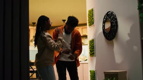 Cheerful Couple Dancing Together in Apartment