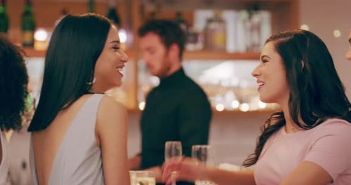 4k video footage of young men and women having drinks at a bar