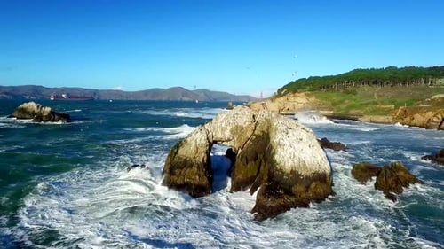 Drone View Of Choppy Ocean And Rocks By San Francisco Beachside 3