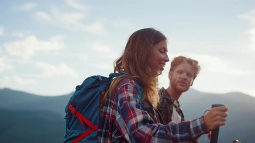 Closeup Smiling Couple Backpack in Summer Mountains. Happy Hikers Walk Nature Outside