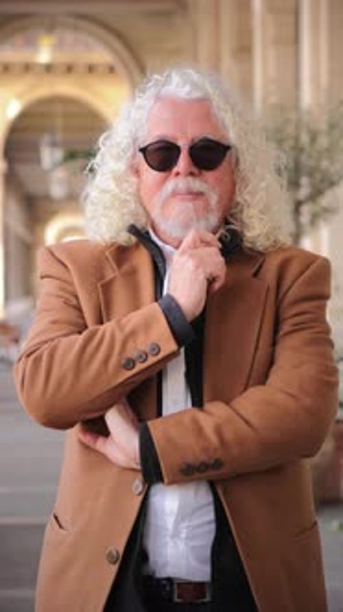 Man With White Hair Wearing Sunglasses Outdoors
