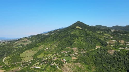 Scenic Aerial View of Green Hills and Mountains