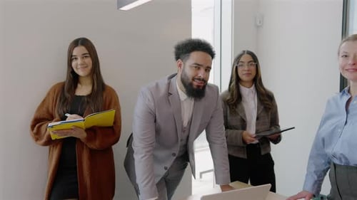 A Variety of Diverse Professionals Work Together in a Modern and Dynamic Office Space