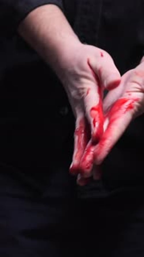 Vertical Video Killer Showing Bloody Shaking Hands and Dropping Knife After Murdering