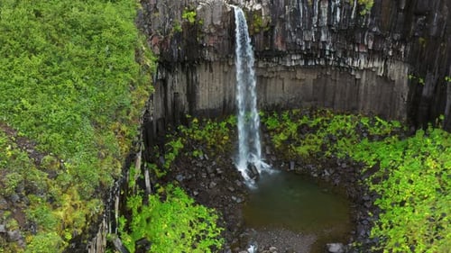 Svartifoss Waterfall In Vatnajokull National Park, Iceland - aerial drone shot