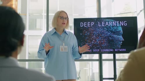 Coach Describing Her Work in Conference Room