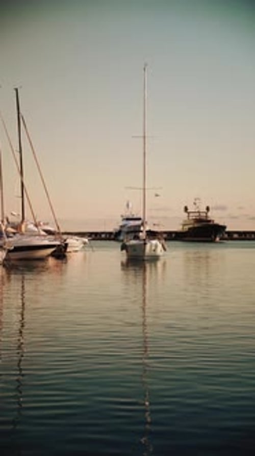 Still Water Reflection of Yachts at Harbour