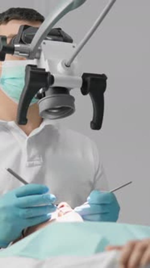 During the Tooth Extraction Procedure the Doctor Uses a Microscope to Precisely Cut and Remove the