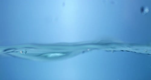 Close-up of Water Bubbles in Slow Motion. The Beauty of Transparent Liquid Droplets.