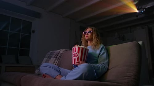 Woman Enjoying Movie Night with Popcorn