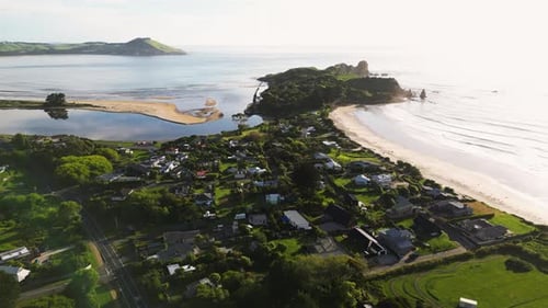 A bizarre aerial view shot above the oblong green peninsula in Karitane area, New Zealand