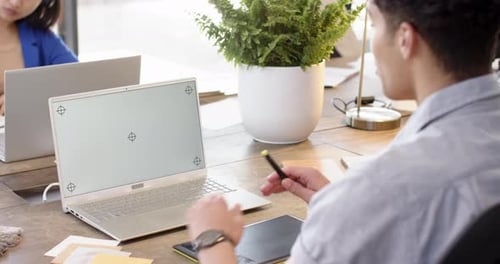 On video call, stylus and laptop, ma, interior design project at desk, copy space, at office