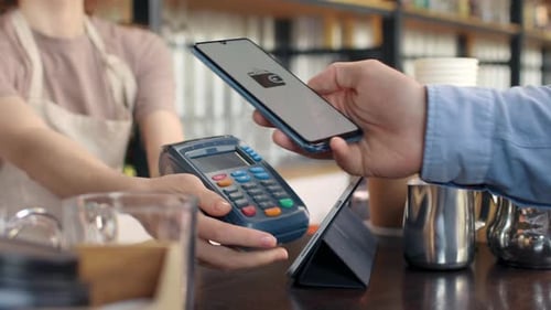 Pay by Phone on Pos Terminal at Coffee Bar. E-Money Transfer From