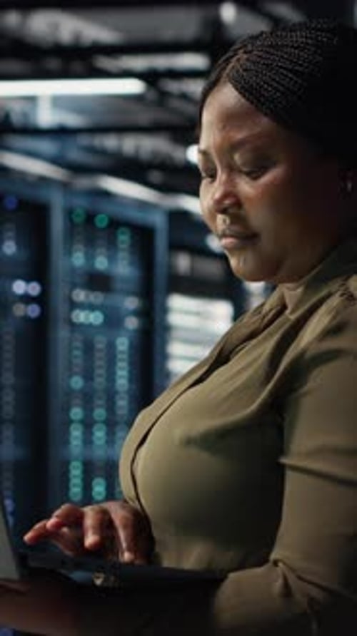 Vertical Video Software Developer in Data Center Using Laptop to Upgrade Systems