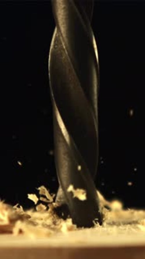 The Drill Drills Wood with Sawdust Filmed is Slow Motion 1000 Fps