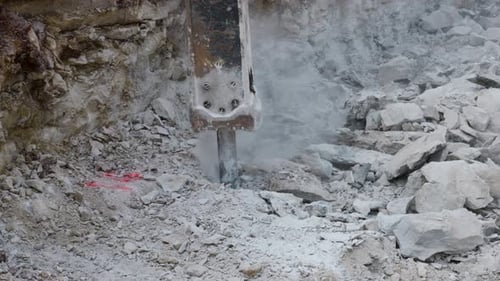 4K Slow Motion Jackhammer Breaking Large Rocks