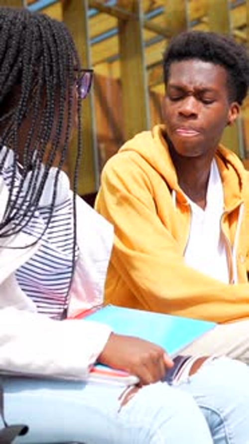 African Students Talking Sitting Together in the University Campus