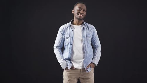 Young Adult Man Posing in Studio on Black