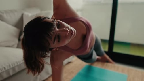 Woman in Side Plank Pose at Home