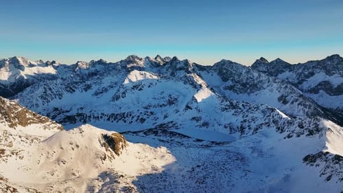 Aerial views of stunning snow-capped Alps and mountain ranges