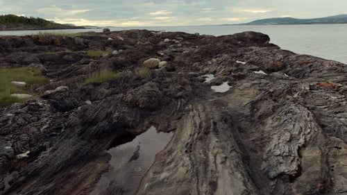 Volcanic Rocky Norway in Cloudy Cold Weather Immersed in Nature