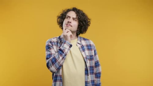 Young Adult Thinking with Hand on Chin