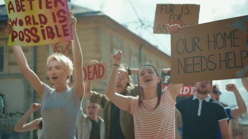 Diverse Group Protesting on Urban Street with Signs