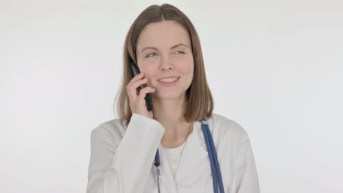 Smiling Doctor Woman Talking on Mobile Phone