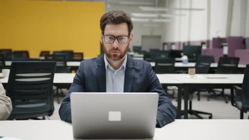 Closeup Shot of Skilled Men and Women in Formal Suits in Modern Office Space