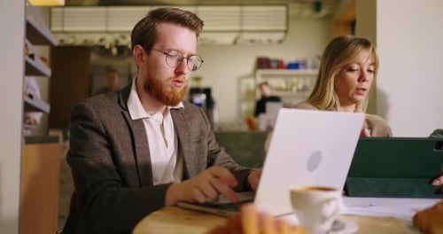 Colleagues Collaborating at Modern Office with Technology