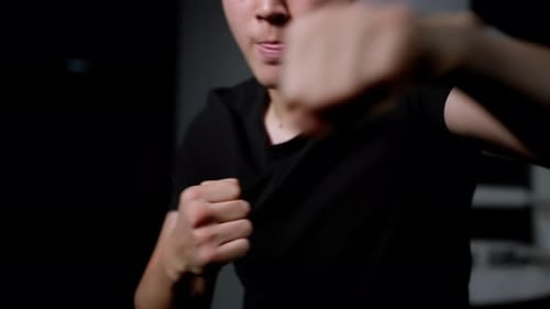 Man Practicing Boxing Punches Close Up