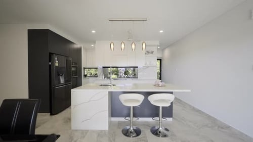 Modern Kitchen Interior with Island and Marble Countertops