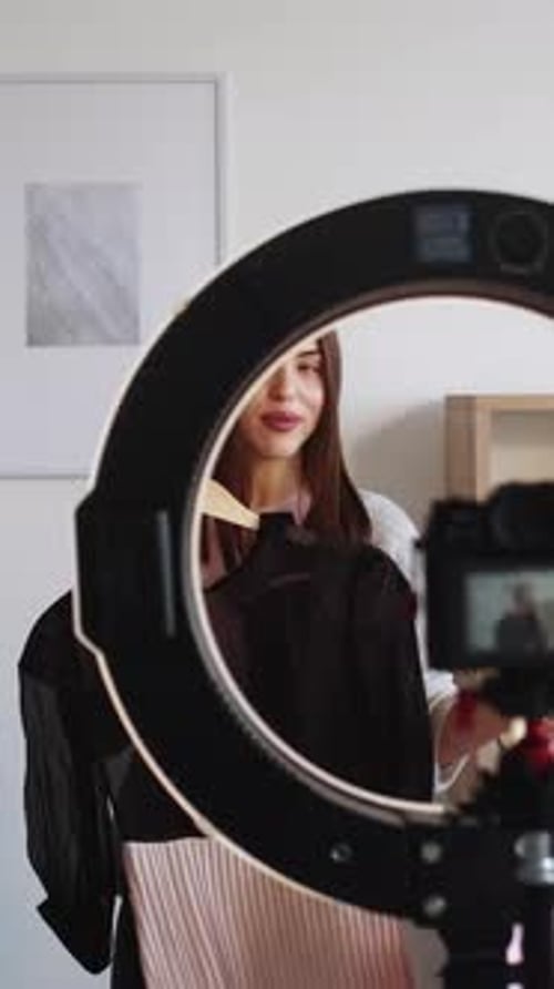 Woman Presents Fashion Choices on Camera