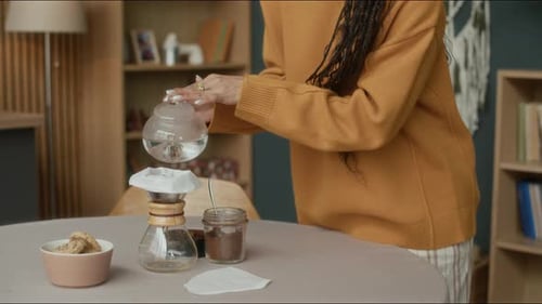 Young Adult Prepares Pour Over Coffee At Home