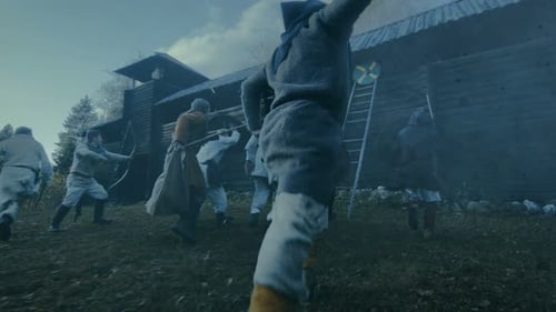 Large-Scale Medieval Battle Reenactment. Violent Tribe of Warriors Attack Wooden Fortress Wall, The