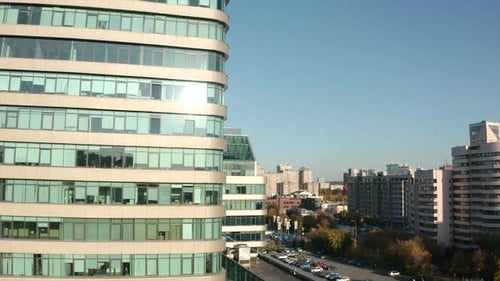 Top view of glass skyscrapers in city on sunny summer day. Stock footage. Beautiful architecture