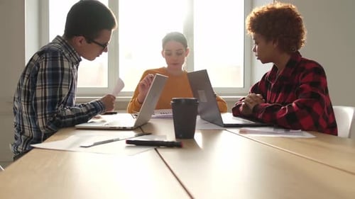 Team at Work Office Meeting Group of Young Business People Working Together in Creative Office Happy